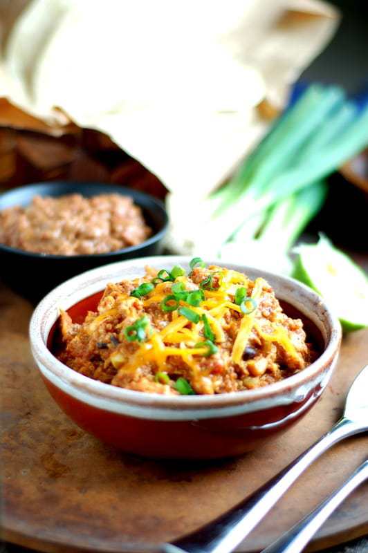quinoa casserole in a bowl with green onions.