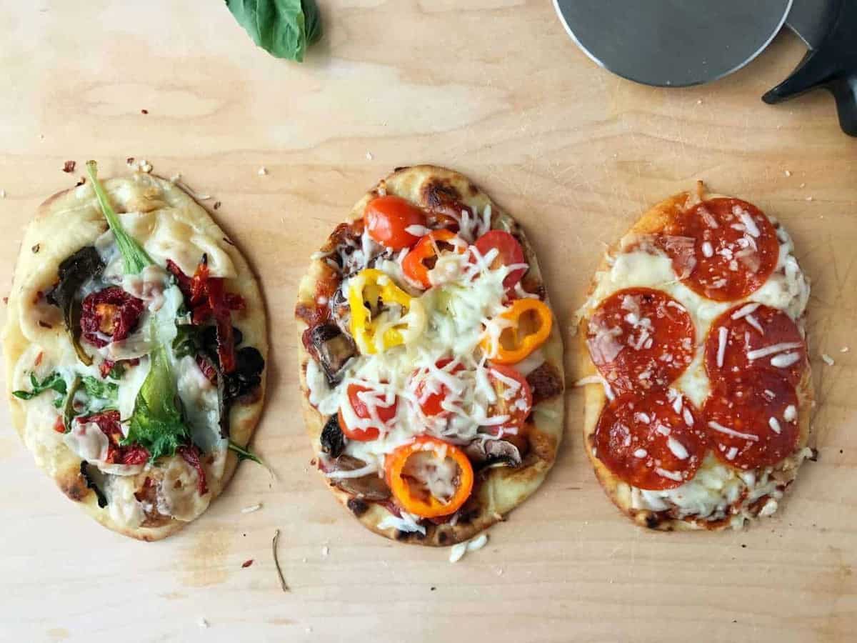 3 individualized pizzas with various toppings that kids like made over the campfire or in a RV.