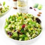 Brussels sprout, Cranberry, & Roasted Almond Salad the perfect Spring salad or Summer salad. This simple salad recipe does not get soggy, the dressing can go on right away. Easy to make using kitchen hack provided for easily shredding Brussels sprouts. A dish to pass that will be a favorite.