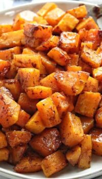 Caramelized butternut squash cubes on a plate.