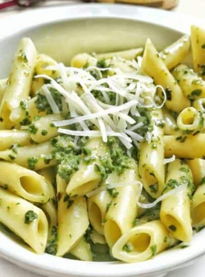 a bowl of pasta with pesto