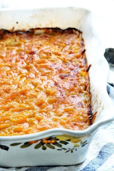 cheesy potatoes baked in a pan