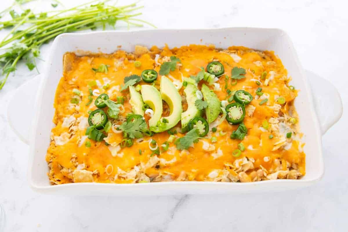 A dish is filled with Chicken enchiladas