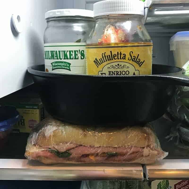 A large sandwich sitting in the fridge