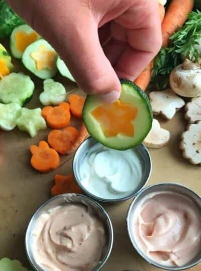 A bunch of different types of vegetables and dip