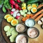 A bunch of different types of vegetable and dip