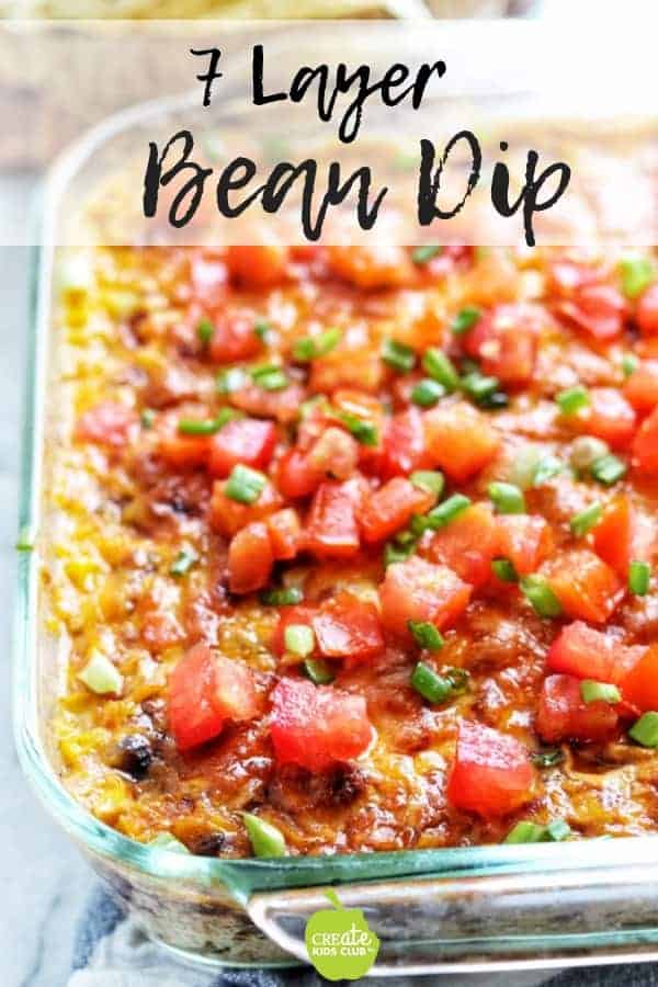 Seven Layer Bean Dip is a healthy appetizer recipe great for tailgating or entertaining. It's a low calorie and low-fat recipe that takes under 30 minutes to make. #layeredbeandip #healthyappetizerrecipe