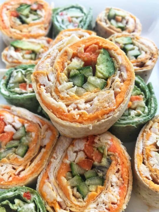 13 turkey pinwheels stacked up on a tray