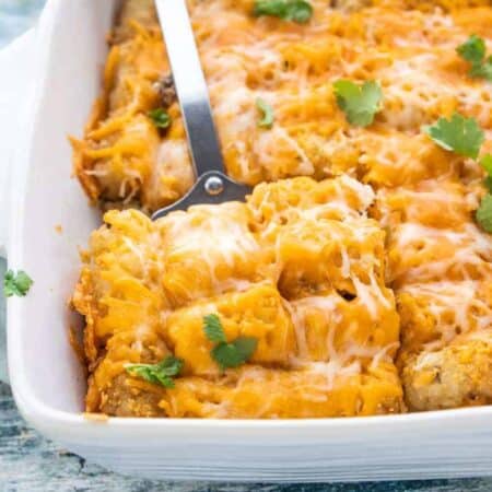 a close up of tater tot casserole in the pan.