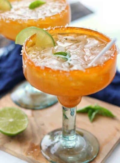 a margarita shown in an orange margarita glass.