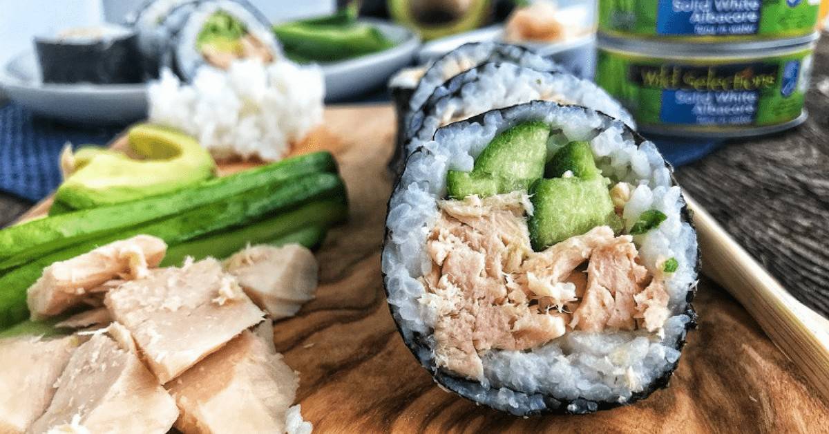 tuna sushi rolls showcasing canned tuna , cucumber, and rice.