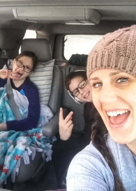 A group of people in a car posing for the camera