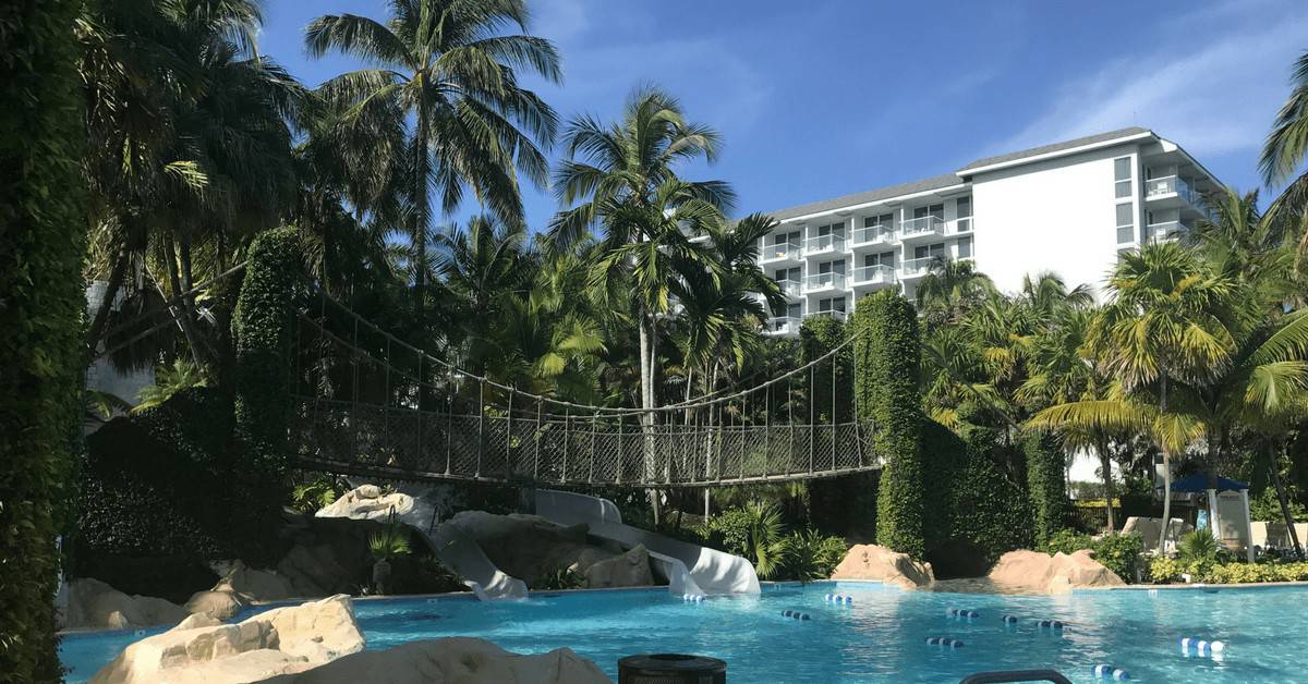 Hilton Rose Hall pool showing the bridge that goes over the pool in the waterpark area. 