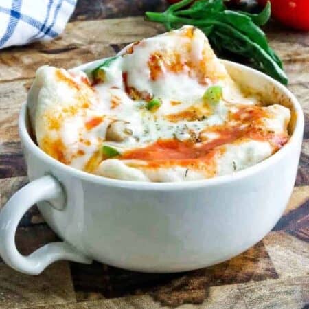 mug pizza in a white cup