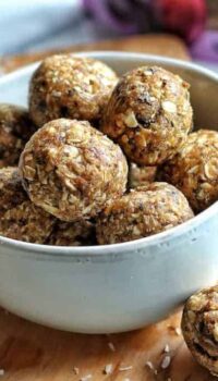 prune and peanut butter energy balls in a white bowl
