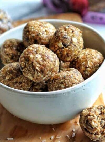 prune and peanut butter energy balls in a white bowl