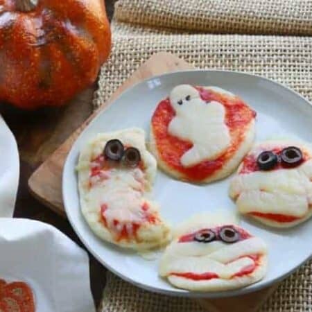 a plate with halloween pizzas