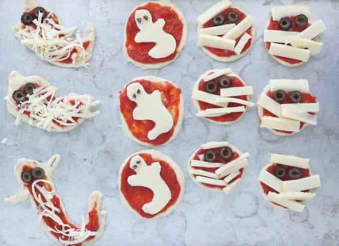 Halloween pizzas on a baking tray