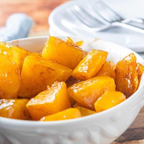 A bowl of baked squash on a table