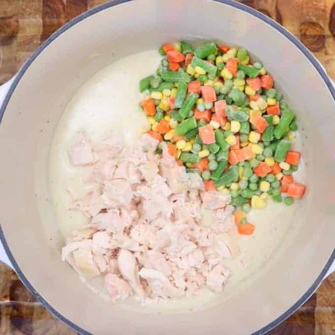 Mixed vegetable and diced chicken are added to roux mixture for easy chicken pot pie.