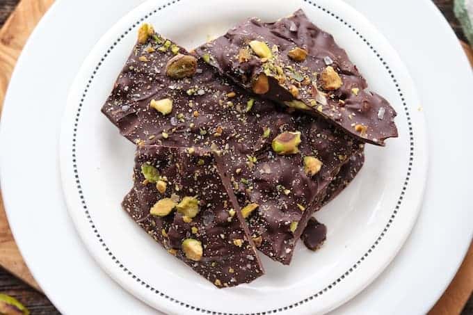 Chocolate Bark recipe shown on a white plate on a wooden surface 