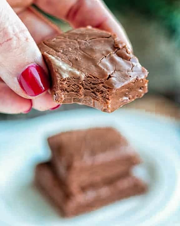 a hand holding no-bake fudge.