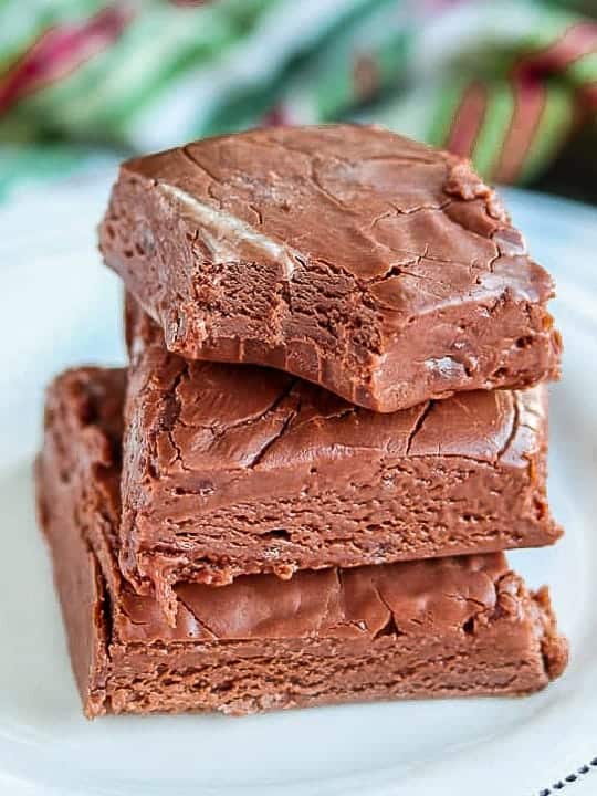 Fudge shown stacked three high on a white plate