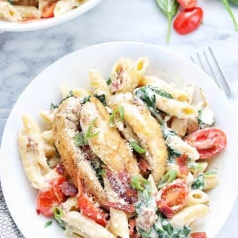 a bowl filled with chicken bacon pasta