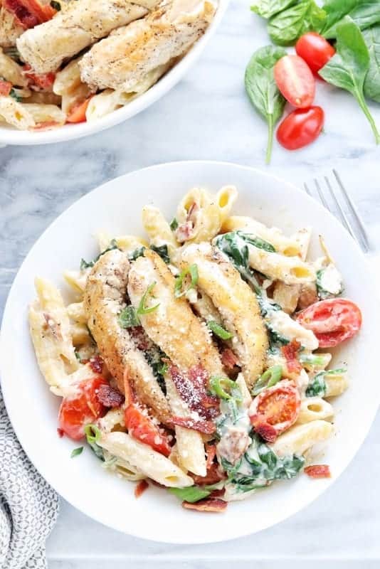 a bowl filled with chicken bacon pasta