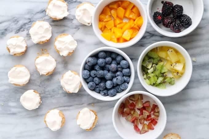 bowls filled with different types of fruit on a table