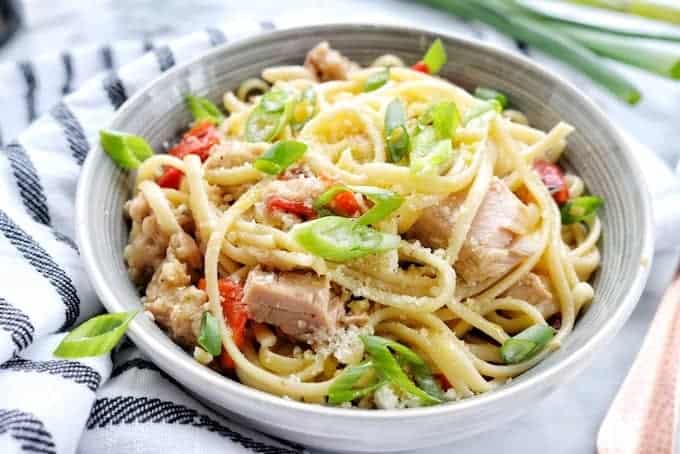 A bowl filled with pasta, tuna, and vegetables