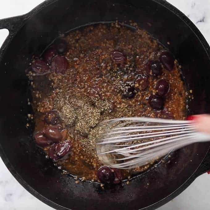 oil, olives, and spices whisked in a skillet