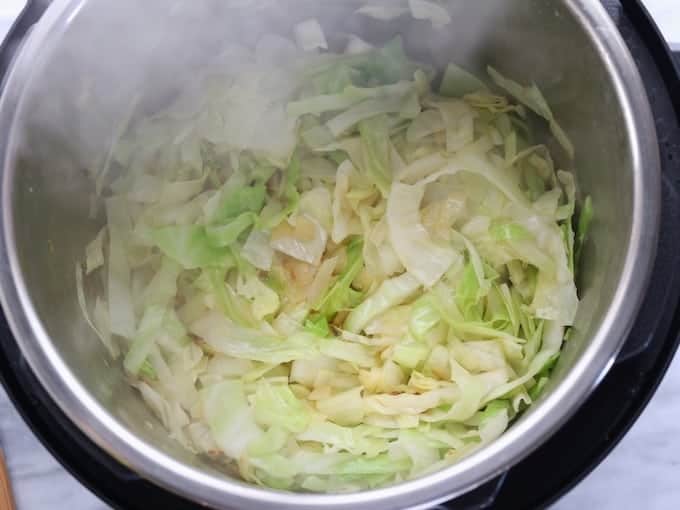 Colcannon recipe showing cabbage being sautéed using the saute mode. 