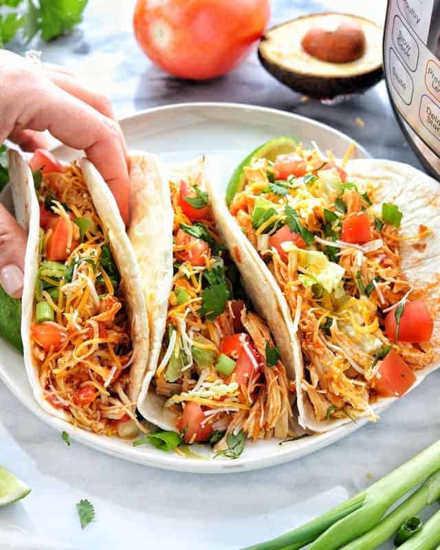 A plate of tacos on a table