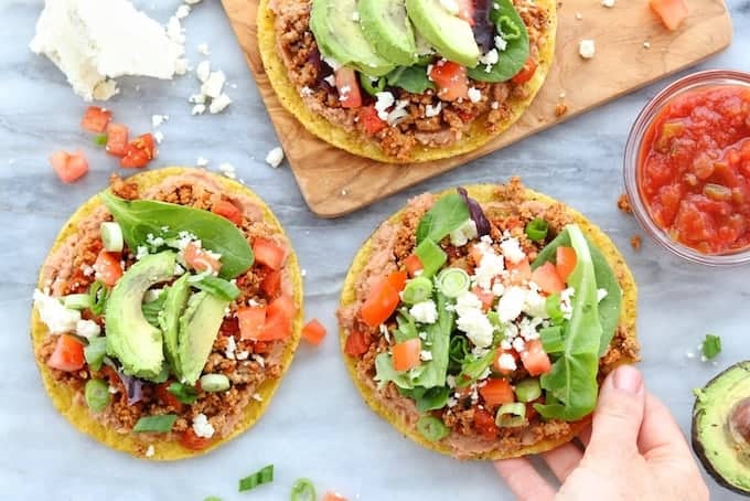 three chicken tostadas on a table.