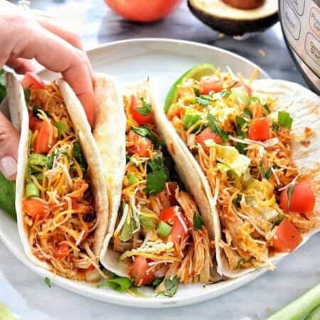 Instant pot or crockpot chicken tacos are shredded chicken tacos with just 4 ingredients.