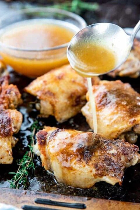 gravy drizzled onto chicken thighs