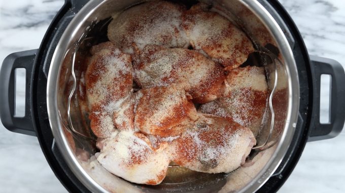 instant pot with chicken thighs and seasonings