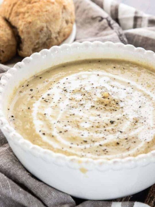 A close up of brussels sprout soup with fresh pepper