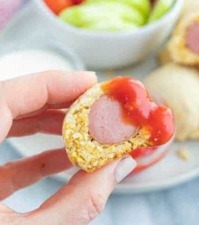 close up of a corn dog with ketchup