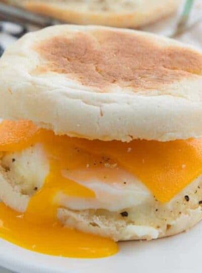 Easy Camping Meals For Kids showing an egg McMuffin with the yolk pouring down the side.