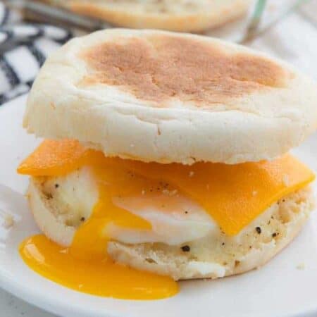 Easy Camping Meals For Kids showing an egg McMuffin with the yolk pouring down the side.