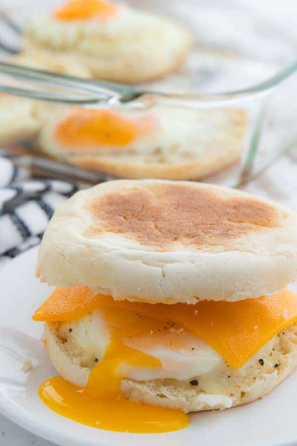 top of muffin placed onto cheese and egg