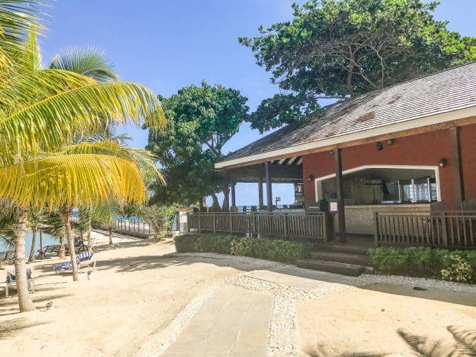 Moonstone restaurant shown on the water with outdoor dining on the water.