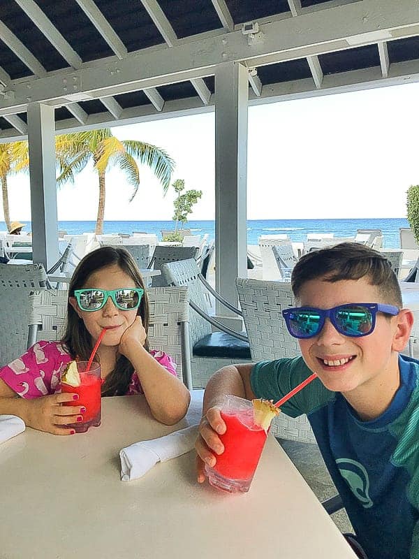 kids drinking smoothies while at the hilton rose hall jamaica