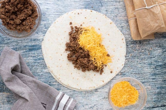 beef and cheese on a tortilla