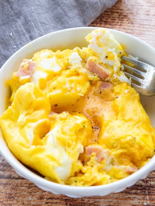 A bowl of boiled omelet with ham
