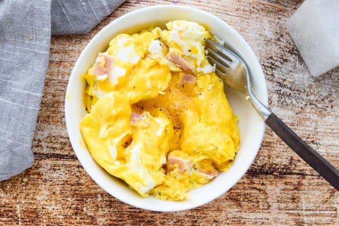 close up of ham and cheese omelet in a bowl