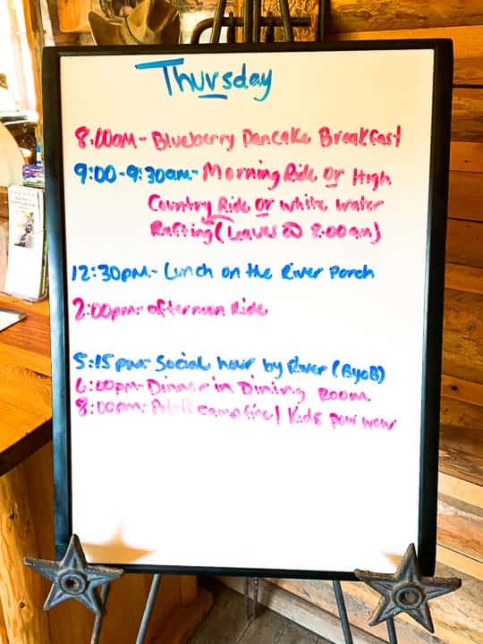 The activity board at a family dude ranch listing the various events happening on the ranch on a Thursday in Colorado. 