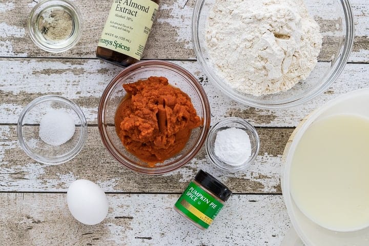 Healthy Pumpkin Pancakes, a pumpkin spice pancake recipe, showing the ingredients in glass bowls. 